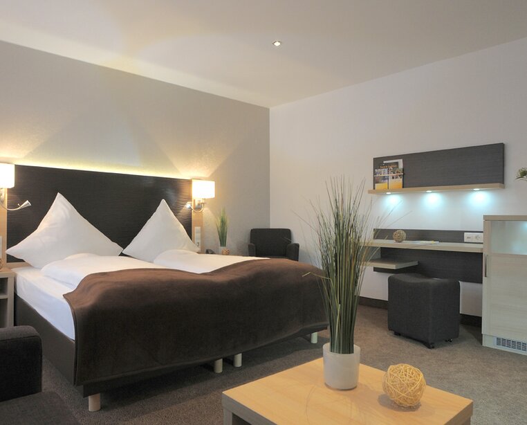 Modern tasteful designed comfort rooms at the 4-star hotel Ringhotel Loew´s Merkur in Nuremberg | © Peter Hülsberg